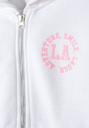Detail of white girls zip-through hoodie with pink printed design and zipper.