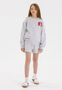 Girls grey crew neck sweatshirt and shorts set, front view, with printed details and pockets.