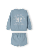 Girls crew neck sweatshirt and shorts set in blue, featuring printed design and elastic waistband.