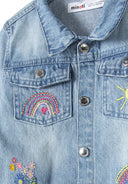 Close-up of a girls denim jacket in blue with embroidered rainbow and sun details.
