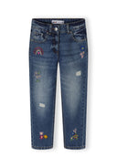 Girls straight leg jeans in navy with embroidered floral accents, front view.