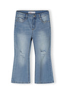 Girls denim flare jeans in light blue, front view with distressed details.