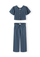 Girls blue blouse with frill sleeves and wide leg trousers, front view.