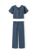 Girls' blue blouse with frill sleeves and wide-leg trousers, front view.
