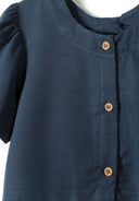 Close-up of a blue blouse with flared frill sleeves and button fastening.