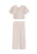 Girls' clothing set with a blouse and wide-leg trousers in soft pink, featuring flared sleeves and elasticated waistband.