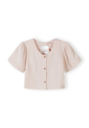 Girls blouse in soft pink with flared sleeves and button fastening at the back.