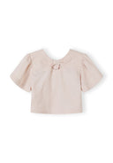 Girls blouse in soft pink with flared sleeves and back button fastening, detail.