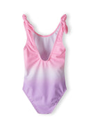 Girls one-piece swimsuit in pink and purple gradient, back view, features tie straps.
