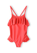 Girls one-piece swimsuit in coral with ruffle detail, front view.