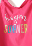 Close-up of a pink one-piece swimsuit with 'bonjour SUMMER' text.