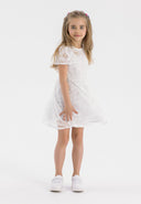 Girls flare sleeve dress in white, featuring lace detail and a flared skirt, front view.
