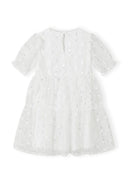 Girls short sleeve white dress with sequin flower details, back view.