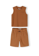 Boys beige vest and shorts set, sleeveless with round neckline, includes side pockets.