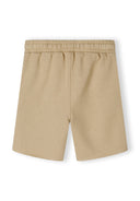 Back view of beige boys' shorts with elastic waistband and side pockets.
