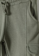 Detail of boys' khaki cargo joggers with elasticated waistband and side pockets.