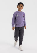 Boys oversized lilac crew neck sweatshirt with graphic print, front view.