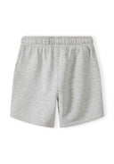 Detail of grey shorts with elasticated waistband and side pockets.