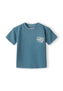 Boys short sleeve t-shirt in blue with tennis print on chest, front view.