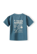 Boys short sleeve t-shirt in teal with tennis print, back view.