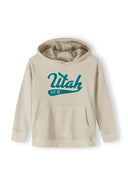 Boys oversized cream hoodie, front view, features kangaroo pocket and decorative print.