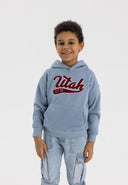 Boys oversized blue hoodie with kangaroo pocket, front view.