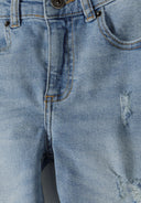 Detail of boys light blue ripped straight leg jeans with front pocket and stitching.