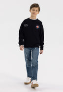 Boys navy ripped straight leg jeans, front view with pockets.