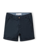 Detail of navy blue shorts with adjustable waistband and side pockets.