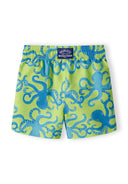 Boys board shorts in bright green with blue octopus print, front view, featuring an elastic waistband.