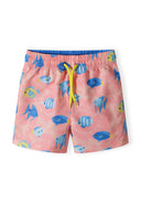 Boys board shorts in salmon color with fish print, front view, featuring adjustable drawstring and two side pockets.