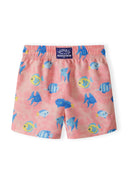Boys board shorts in salmon color with an all-over fish print, back view, featuring an adjustable waistband.
