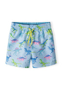 Boys board shorts in light blue with dinosaur print, front view, featuring adjustable drawstring and side pockets.
