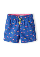 Boys board shorts in cobalt blue with flamingo print, front view, adjustable drawstring.