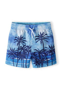 Boys swim shorts in light blue with palm tree print, front view, featuring adjustable drawstring waist.