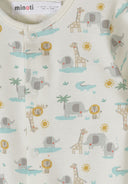 Close-up of breathable cotton baby sleepsuit with cream safari animal print and snap buttons.