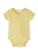 Soft yellow short sleeve baby bodysuit with snap closures and minimalist design for comfortable wear