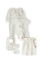 Unisex baby gift set with cream cotton sleepsuit, bodysuit with animal design, matching bib, mittens, hat, and storage bag.