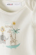 Close-up of cream baby sleepsuit with cute jungle animal design and soft cotton fabric for infants 0-6 months