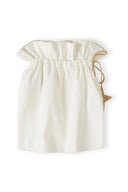 Cream-colored cotton drawstring bag with gathered top, showcasing simple and elegant design for baby gift set packaging.