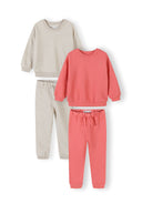 Two-piece girls tracksuit set featuring coral and cream cotton sweatshirt and joggers with adjustable waist design