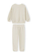 Cream-colored kids tracksuit sweatshirt and joggers with a simple, comfortable design for everyday wear.