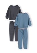 Two boys' cotton tracksuits in blue and gunmetal with embroidered details and comfortable design for kids.