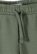 Close-up of olive green cotton joggers waistband with adjustable drawstring and elastic detail for boys' comfort and style.