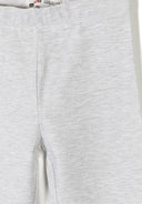 Close-up of soft light grey girls jersey leggings with stretchy cotton fabric and clean design details