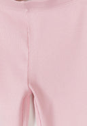 Close-up of soft pink ribbed fabric detail on kids' flare leggings with elasticated waistband design.