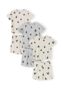 Six ribbed cotton pyjama pieces laid flat showing three complete sets in cream and grey with black hearts print pattern