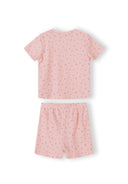 Close-up of pink ribbed pyjama set with small floral print pattern showing top and matching shorts