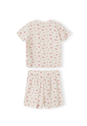 Detail view of pink ribbed fabric texture showing delicate floral print pattern and elastic waistband