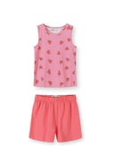 Close-up detail of pink elastic waistband shorts with watermelon heart pattern print, showing Minoti label and fabric texture